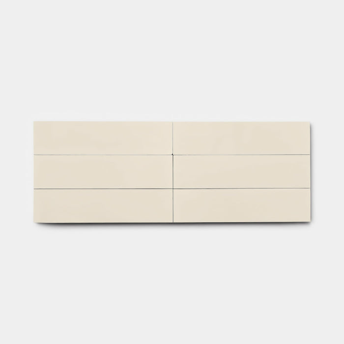 The Bone 2x8 dresser by vendor-unknown features a minimalist off-white finish and six horizontal drawers in two rows of three, set against a plain, tile-inspired white background.