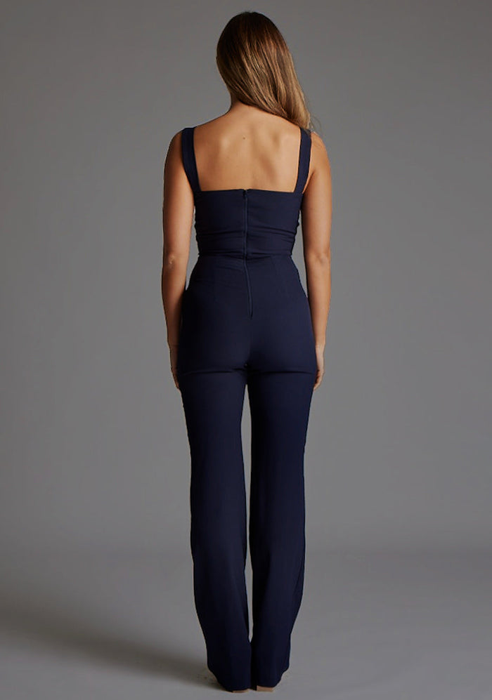 Back image of a model wearing the Vesper Collette Sweetheart Wide Leg Jumpsuit in Navy, highlighting the clean back design and fluid wide-leg trousers.