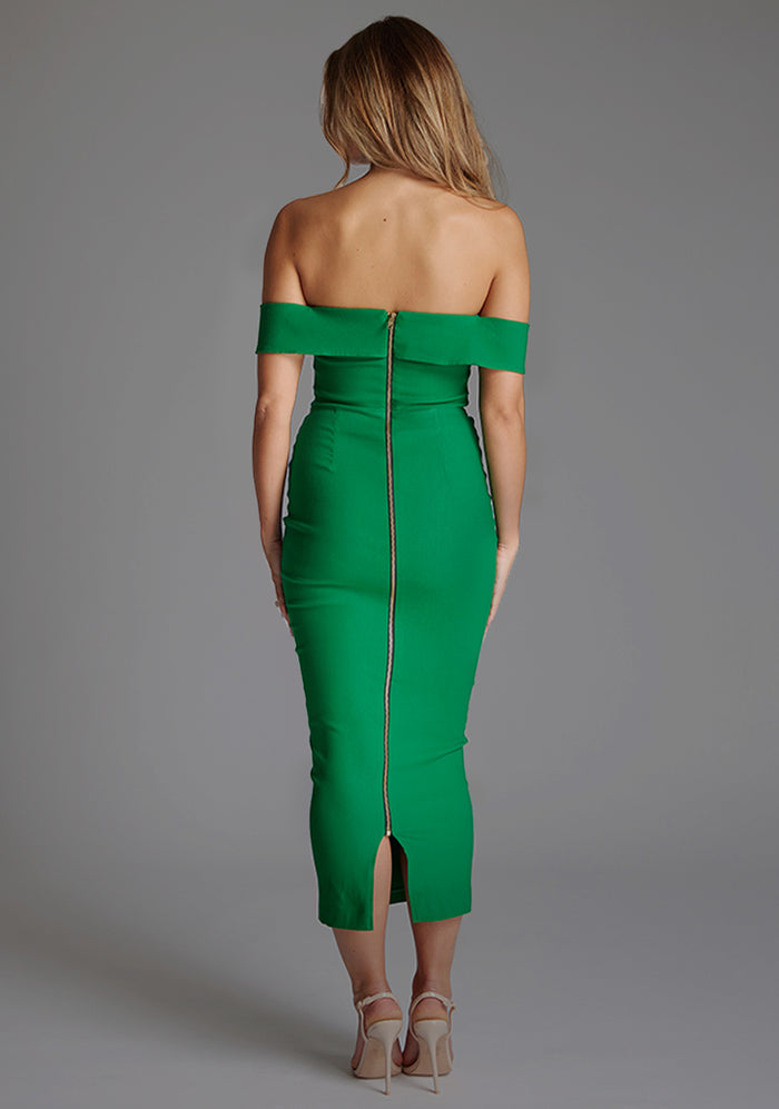 Green off-shoulder dress worn by a model on a gray background
