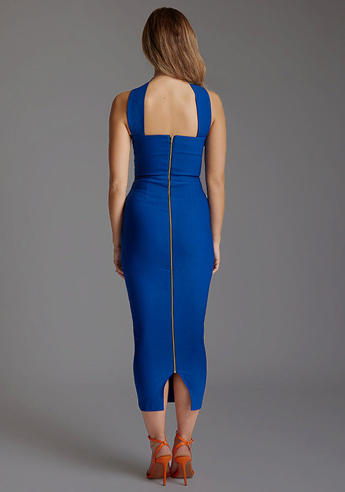 Back image of a blonde model wearing a cobalt midaxi dress with a strapless design and unique collar detail exudes sophistication, while the bodycon silhouette flatters your form. The design featured is the Vesper Frankie Cobalt Midaxi Dress