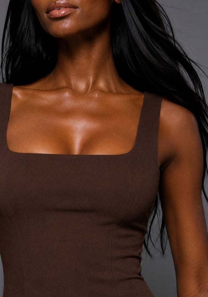 Close-up image of a model wearing the VSPR Marianna Square Neckline Fishtail Chocolate Midaxi Dress, highlighting the structured square neckline, wide straps and premium stretch luxe fabric.