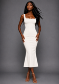 Front image of a model wearing the VSPR Marianna Square Neckline Fishtail Midaxi Dress in Ivory with a structured square neckline, sculpted silhouette, and softly flared mermaid hem, standing against a grey studio backdrop.