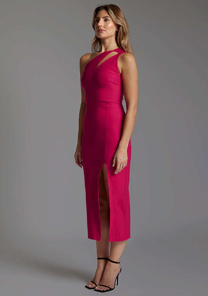 Front quarter image of a model wearing a cerise midaxi dress with a asymmetric one-shoulder design features a tasteful cut out, while the front skirt split adds a chic, dynamic element and flattering bodycon fit. The design featured is the Vesper Ollie Cerise One Shoulder Midaxi Dress
