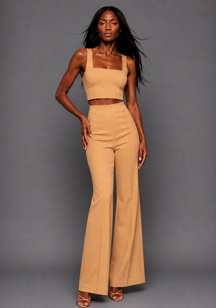 Front image of a model wearing the VSPR Mia Square Neck Coffee Crop Top and matching VSPR Shea Coffee Wide Leg Trousers, showing the square neckline and high-rise wide-leg silhouette, standing against a grey studio backdrop.