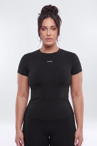 Woman wearing a black t-shirt with 'novo' branding on a white background