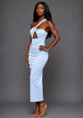 Side front image of a model wearing the VSPR Tierney One Shoulder Cut Out Blue Midaxi Dress, showcasing the sculpted fit, elegant cut-out detail, and premium satin fabric against a grey studio backdrop.